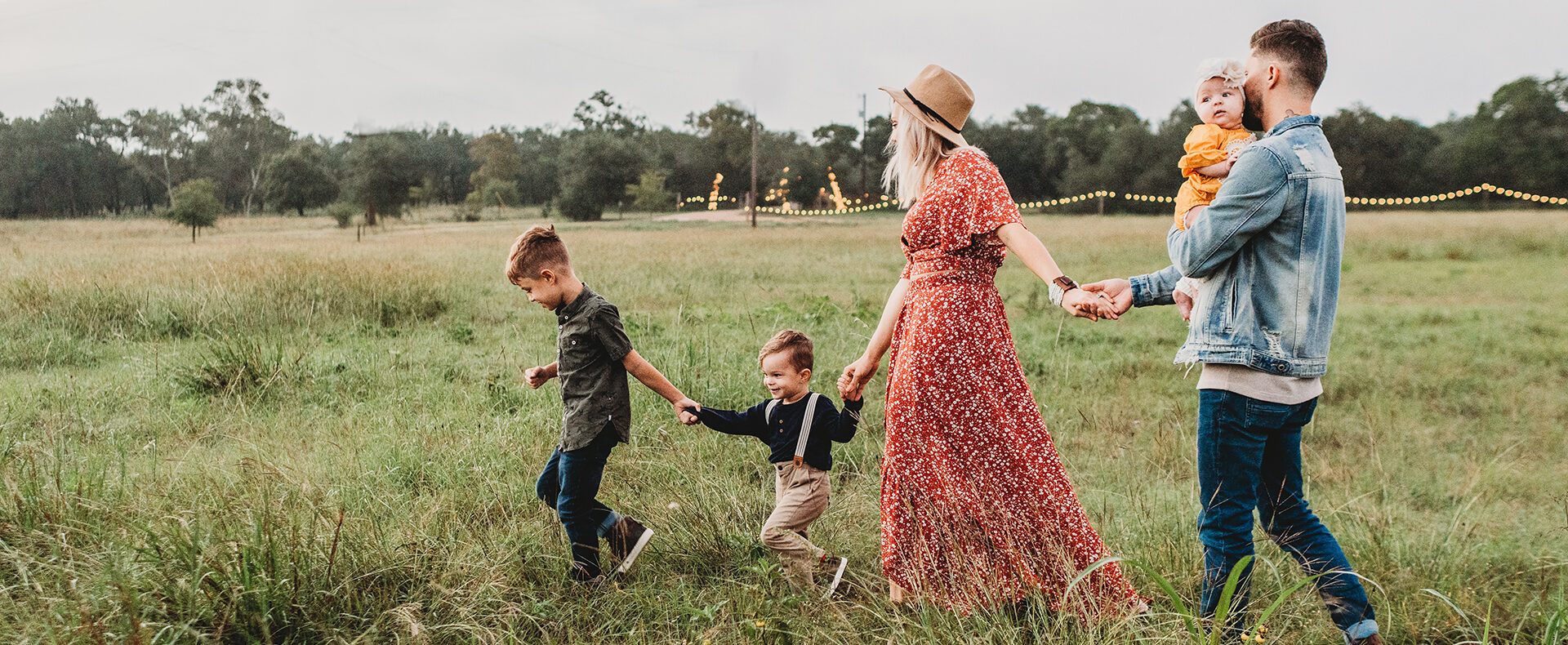 family walking in a field